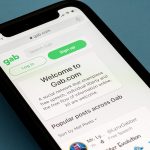 Morgantown, WV - 12 January 2021: Modern iphone with gab social media site showing home page for the website
